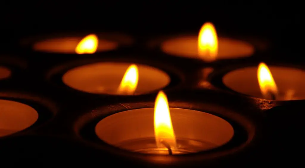 A couple of flickering candles Image Source