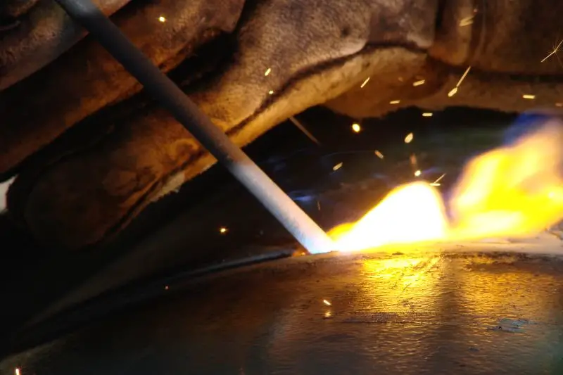 A close up shot of a pipe welder in action.