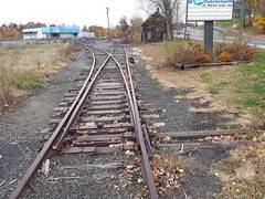 A Fork in the rr tracks near a small town Image Source