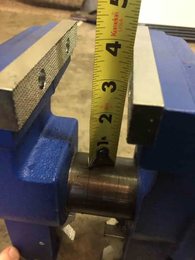 A picture measuring the throat depth of the yost 750-di vise.