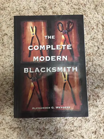 A picture of the front cover of "The Complete Modern Blacksmith" by Alexander G. Weyger.